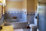Ensuite Primary Bathroom with separate soaking tub and shower